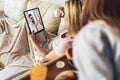 Ill woman having medical teleconsultation using laptop at home Royalty Free Stock Photo