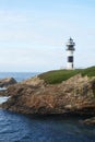 Illa Pancha lighthouse in Ribadeo, Galicia, Spain Royalty Free Stock Photo