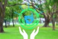 Illustration hand under save world eco icon on nature background , eco environment concept Royalty Free Stock Photo