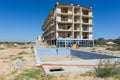 Illegal construction on the coastal side, hotel demolition, unfinished swimming pool in the foreground