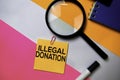 Illegal Donation text on sticky notes with color office desk concept Royalty Free Stock Photo