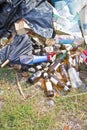 Illegal dumping with bottles, boxes and plastic bags abandoned in nature Royalty Free Stock Photo