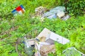 Illegal dumping - Various objects abandoned in nature Royalty Free Stock Photo