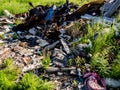 Illegal garbage dump. Large pile of metal, wooden and plastic waste. Pollution concept Royalty Free Stock Photo