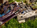 Illegal garbage dump. Large pile of metal, wooden and plastic waste. Pollution concept Royalty Free Stock Photo