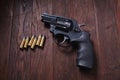 illegal handgun on wooden table