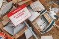 An illegal landfill in the countryside with an overturned no dumping sign. Royalty Free Stock Photo