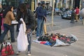 Illegal trade in Barcelona. Traders are collecting their goods quickly because the police already close