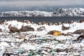 Illegal trash dump in the Arctic snow polluting the pristine environment on the sea