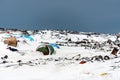 Illegal trash dump in the Arctic snow polluting the pristine environment