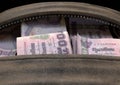 Illicit Cash In A Brown Duffel Bag