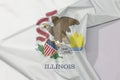 Illinois fabric flag crepe and crease with white space. Seal of Illinois on a white background