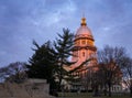 Illinois State Capitol building with trees in Springfield Illinois at sunrise with blue sky