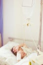 Illness asian boy lying on sickbed in hospital