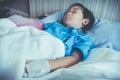 Illness asian child admitted in hospital with saline intravenous