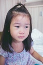 Illness asian child crying while admitted in hospital. Vintage t Royalty Free Stock Photo