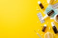 Illness concept. Top view photo of medicines bottles pills blisters thermometer face mask cup of tea and cut lemon on isolated