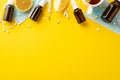 Illness concept. Top view photo of medicines bottles pills capsules thermometer face masks cup of tea and cut lemon on isolated