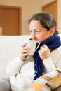 Illness woman drinking hot tea Royalty Free Stock Photo