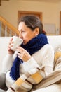 Illness woman drinking hot tea Royalty Free Stock Photo