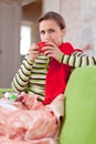 Illness woman drinking hot tea Royalty Free Stock Photo