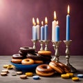 Concept of Jewish religious holiday Hanukkah, donuts and candles on a table with coin