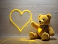 Heartfelt Radiance: Yellow Laser Artistry of a Teddy Bear Love Story