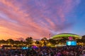 Illuminated Adelaide Oval under spectacular sunset clouds with people Royalty Free Stock Photo