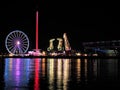 Illuminated amuzement park seen across a river - Szczecin Poland Royalty Free Stock Photo