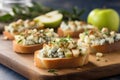 illuminated apple gorgonzola bruschettas with sprigs of thyme on a wooden crate