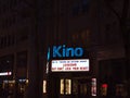 Illuminated billboard above entrance of cinema (\