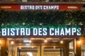 Illuminated Bistro des champs restaurant brand name on Champs Elysees avenue in Paris