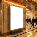 Illuminated blank advertisement display with people walking in a marble floored hallway area Royalty Free Stock Photo