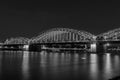 Illuminated bridge in Cologne at night in black and white