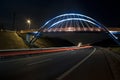 Illuminated bridge at night