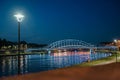 Illuminated Bridge Over Vistula River at Night in Krakow Royalty Free Stock Photo