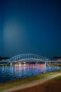 Illuminated Bridge Over Vistula River at Night in Krakow Royalty Free Stock Photo