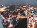 Illuminated bridge on winter river in Kharkiv city