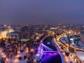 Illuminated bridge on winter river in Kharkiv city