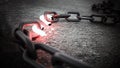 Illuminated broken chain part on the ground. 3D illustration Royalty Free Stock Photo