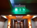 Illuminated building emergency exit sign Royalty Free Stock Photo