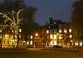 Illuminated buildings around park square in leeds at night Royalty Free Stock Photo