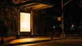 Illuminated bus stop with blank billboard at night Royalty Free Stock Photo