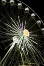 Illuminated carousel wheel in night.