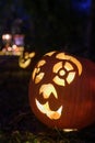 An illuminated carved pumpkin ready for Halloween