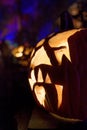 An illuminated carved pumpkin ready for Halloween