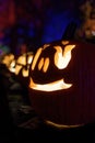 An illuminated carved pumpkin ready for Halloween