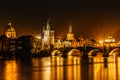 Illuminated Charles Bridge,Karluv most reflected in Vltava River. Evening panorama of Prague, Czech Republic. Long exposure city Royalty Free Stock Photo