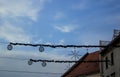 Illuminated Christmas decoration bell and snowflakes on the street. Royalty Free Stock Photo