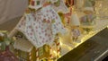 Illuminated Christmas decorations with lights, behind the store shopfront window